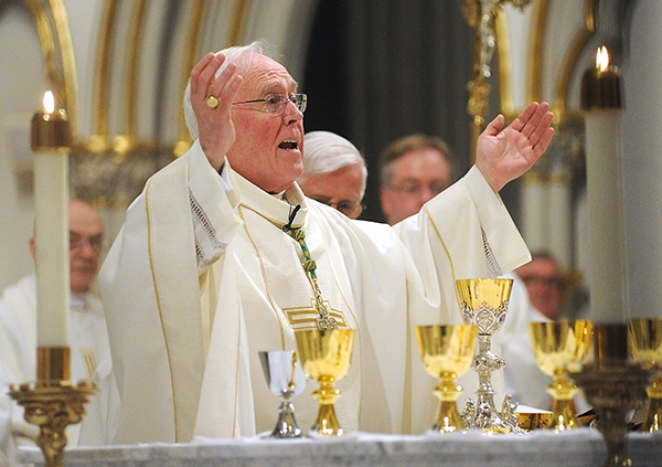 Bishop Richard Malone blesses the gifts at St. Joseph Cathedral during the annual Chrism Mass. (Dan Cappellazzo/Staff Photographer)